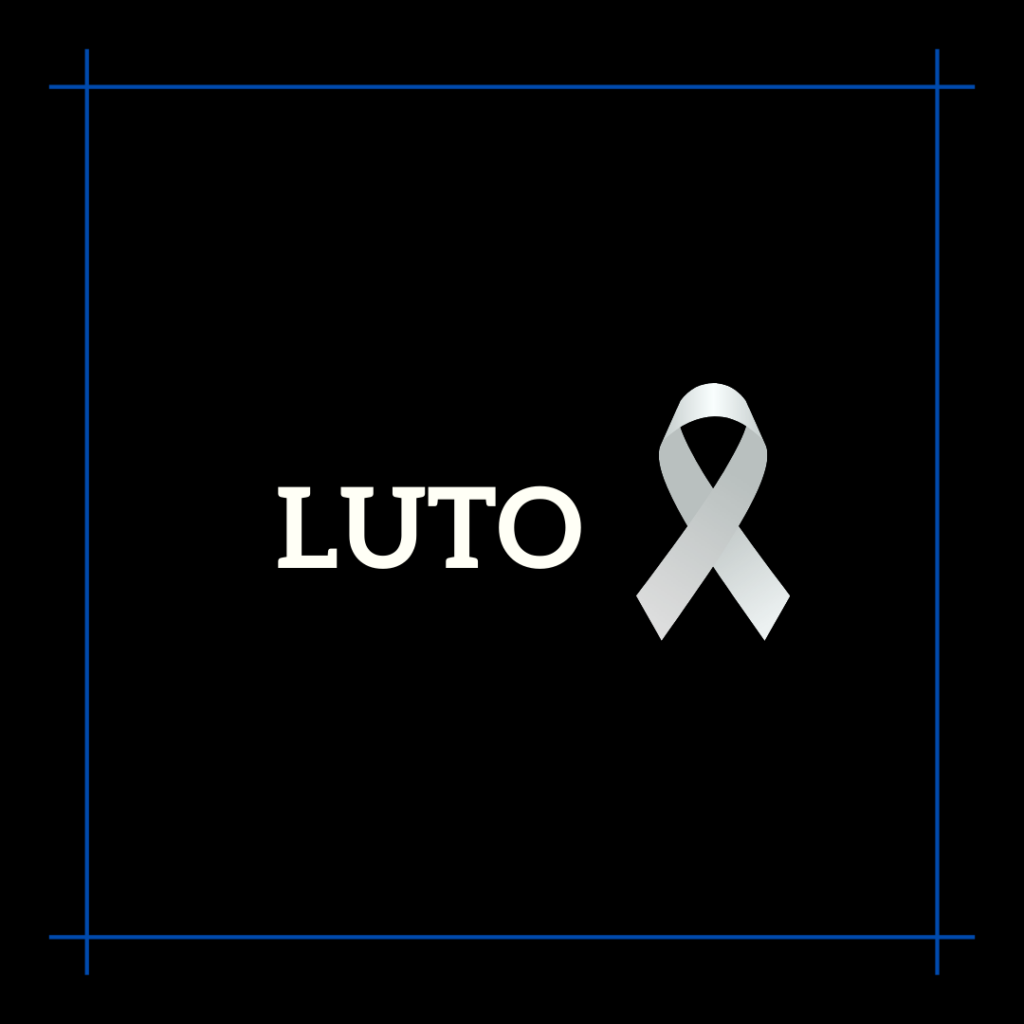 imagem em preto, que aparece ao centro da imagem a palavra: "LUTO", e ao lado, o laço-símbolo de luto, em cores brancas.